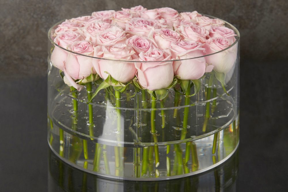 25 fresh roses in Large Rose Acrylic Round Box
