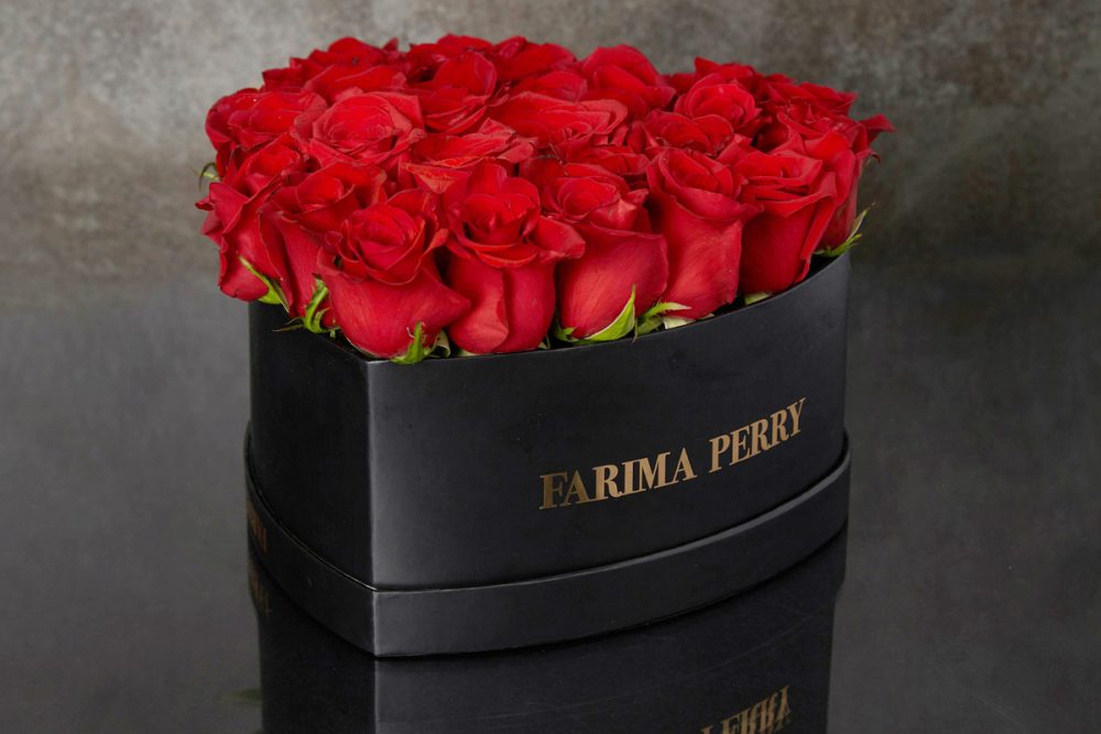 Red Roses in signature Black Heart Flower Box